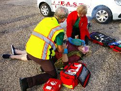 Emergency responders practising CPR